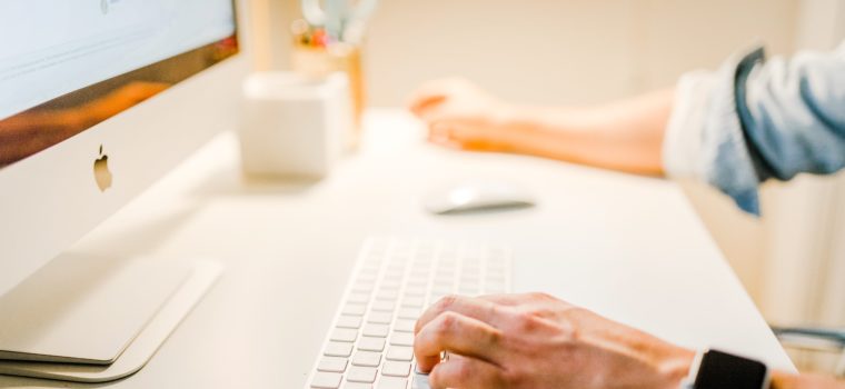 person using iMac